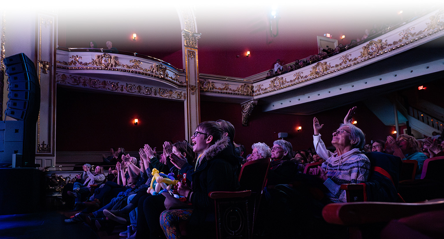 people in theatre clapping